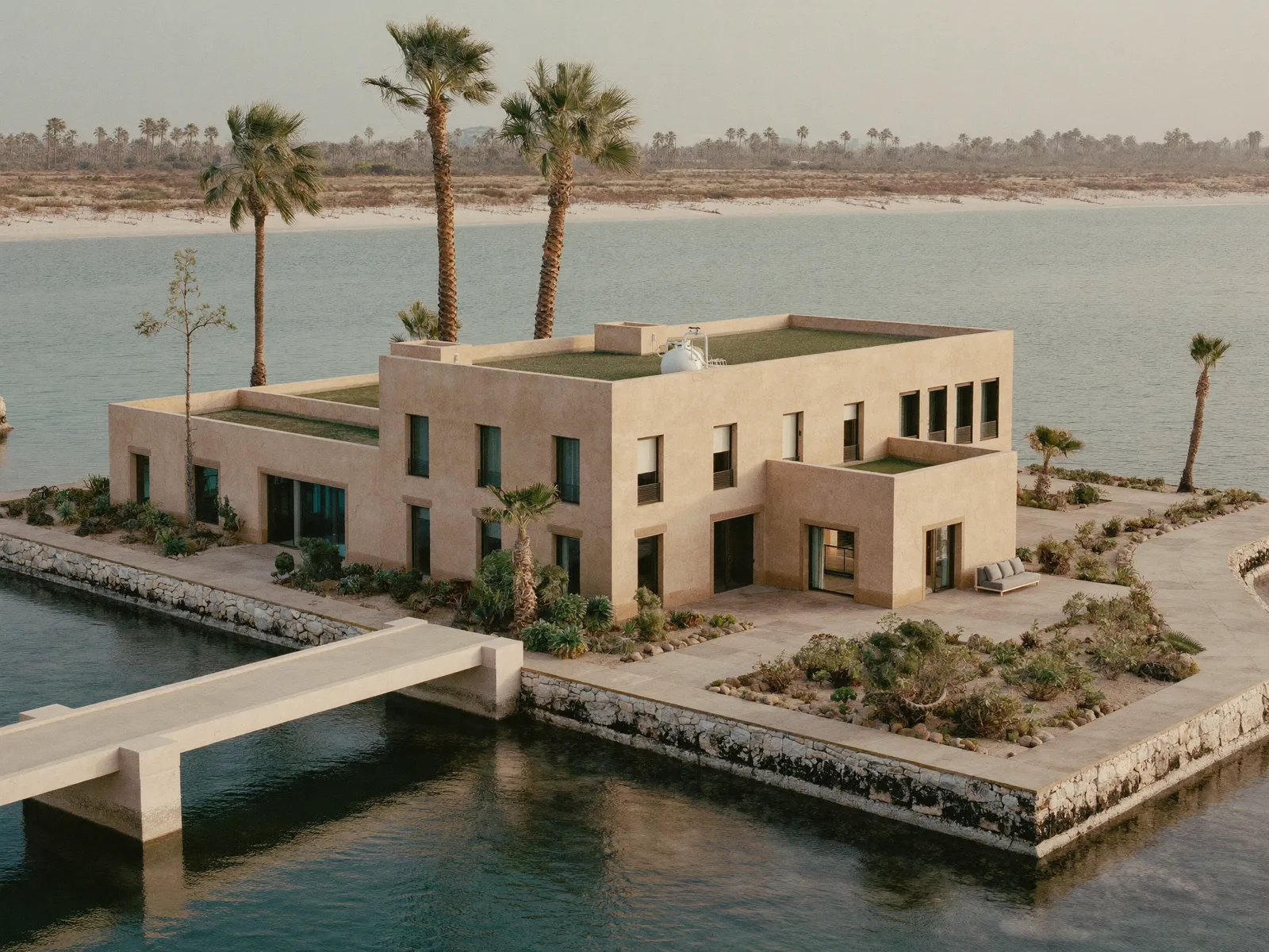 Villa on a Jumeirah Islands cluster surrounded by water, with a roof tank and palm trees