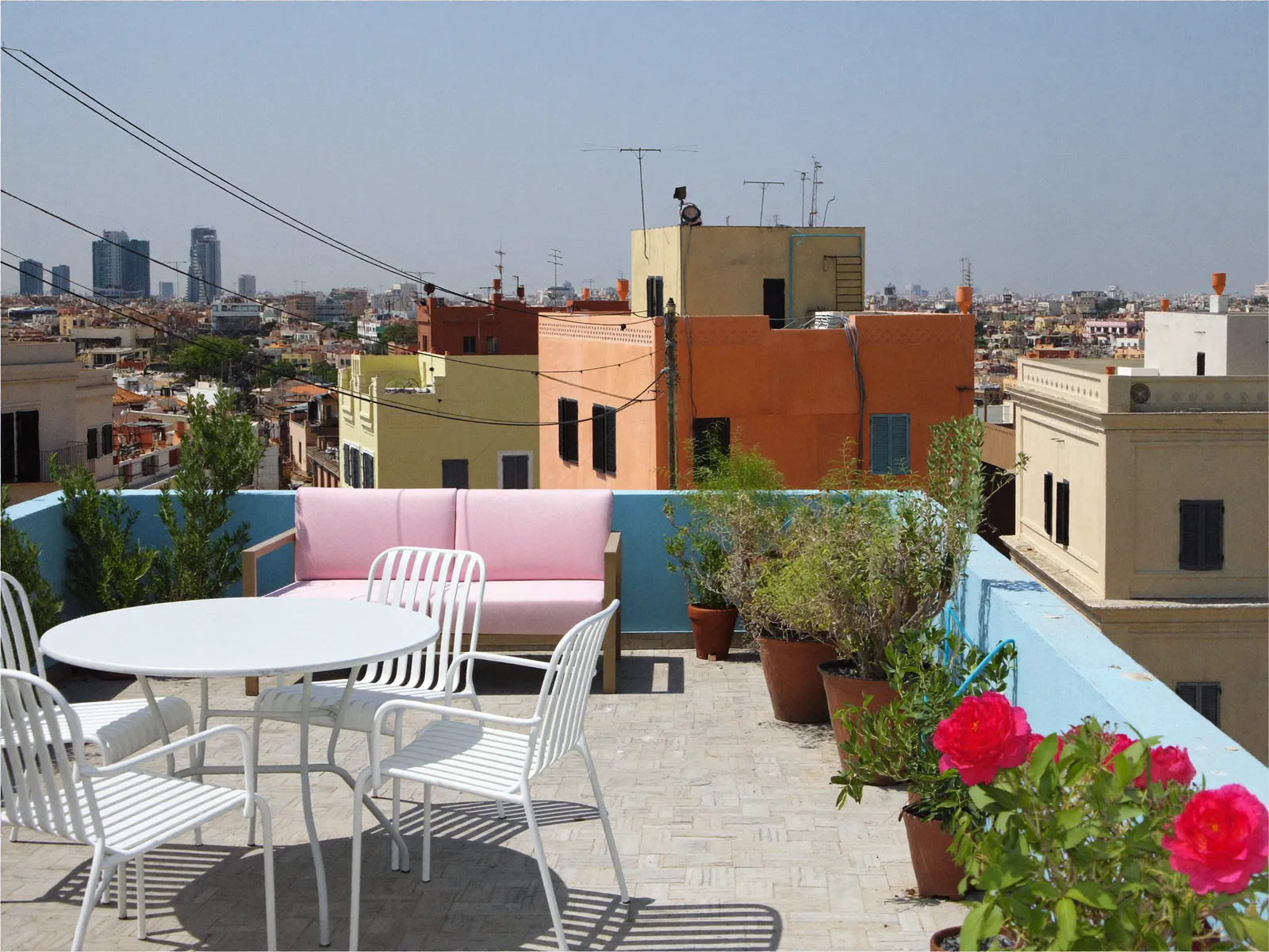 Pastel-coloured townhouses in Mudon, Dubai, with water tanks on the roof terraces